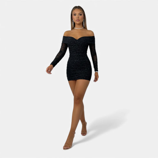Black off-shoulder dress worn by a model on a white background